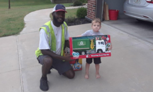 Aaron Mitchell, with American Waste Control, surprised a young fan in Jenks, Okla. with his very own recycling truck. (Photo: Facebook)
